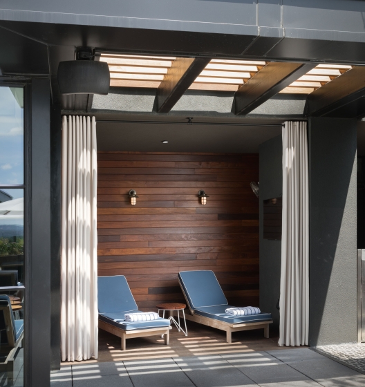 Open cabana with two chairs and towels