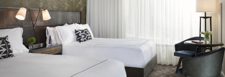 Two queen beds with coffee table