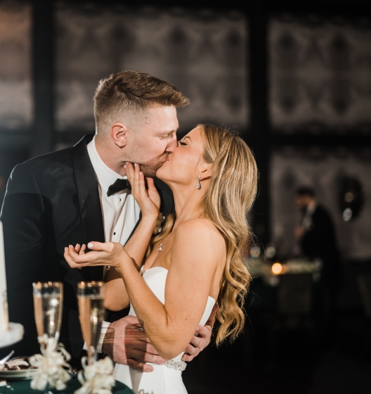 Happy bride and groom sharing a kiss.