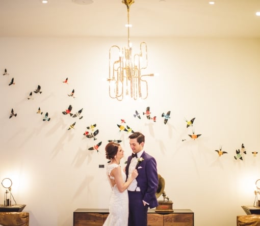 Bride and groom holding each other for photo