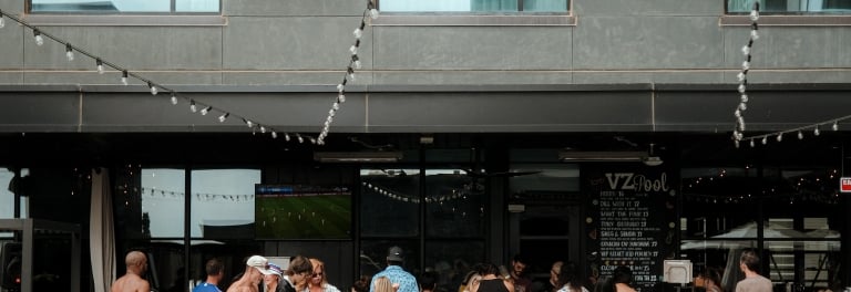 People at a rooftop pool