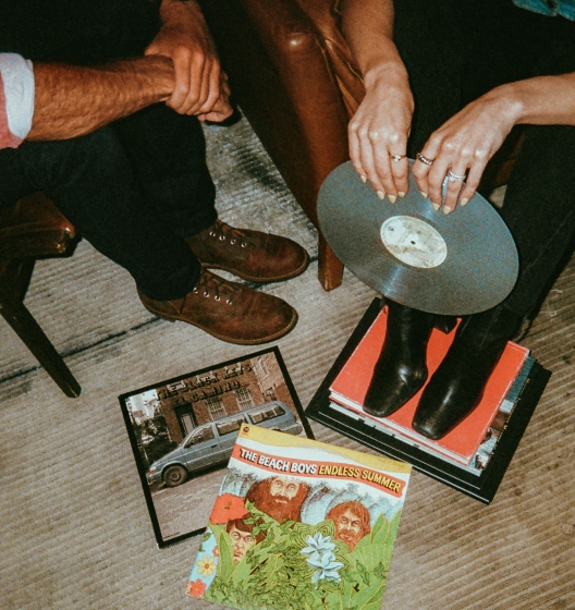 People sitting together with records