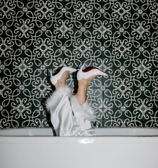 woman in the bath with legs up