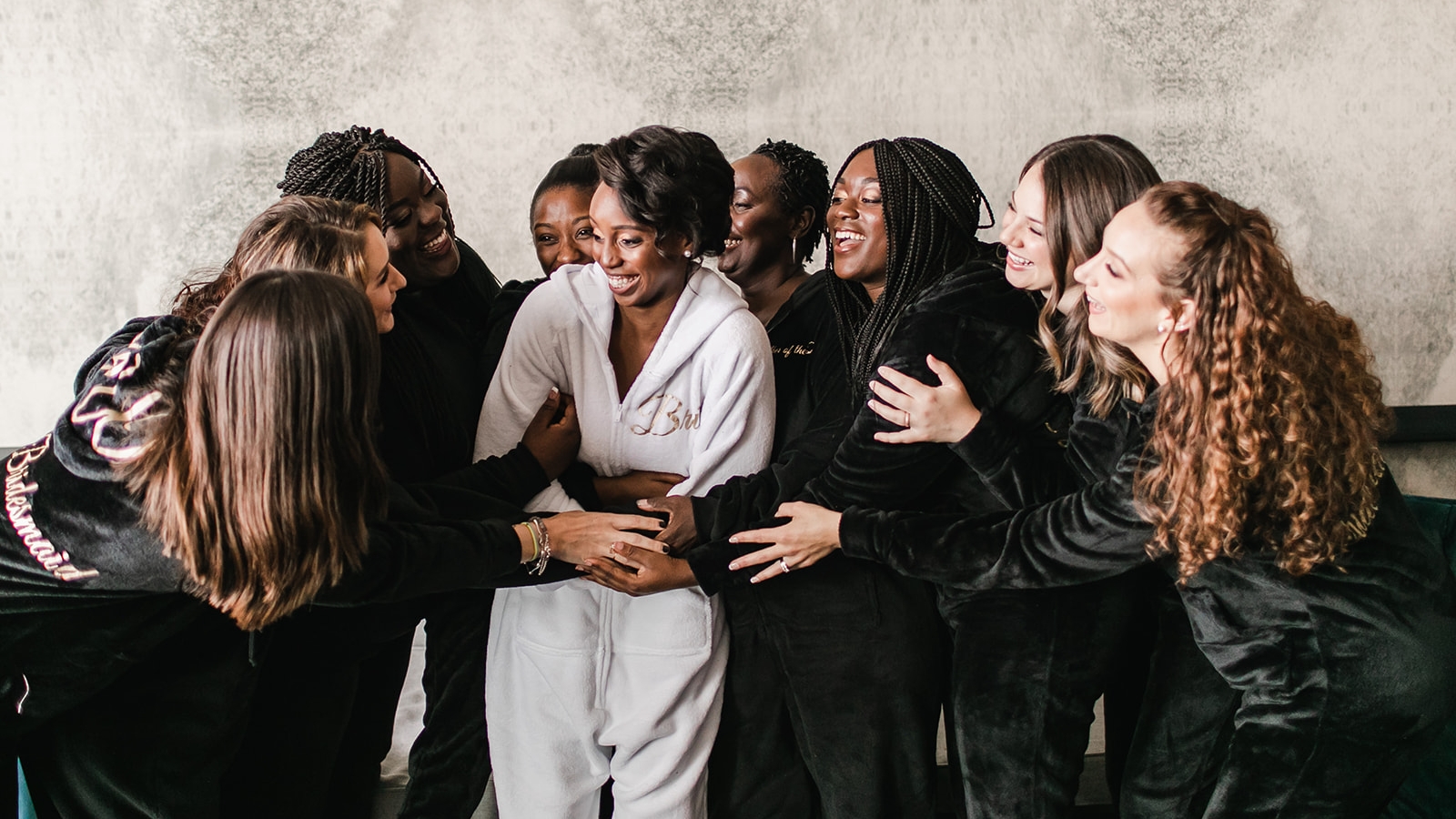 group of women hugging each other