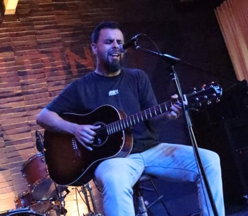 Guitarist performing live on Geraldine's stage