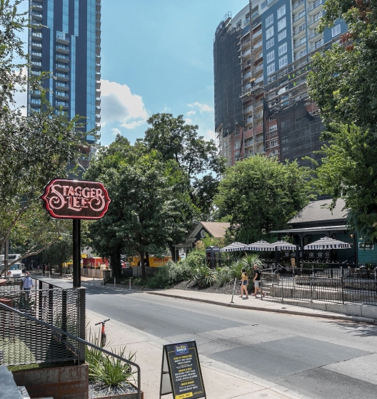 Bustling 6th Street entertainment district in downtown Austin, Texas near Hotel Van Zandt